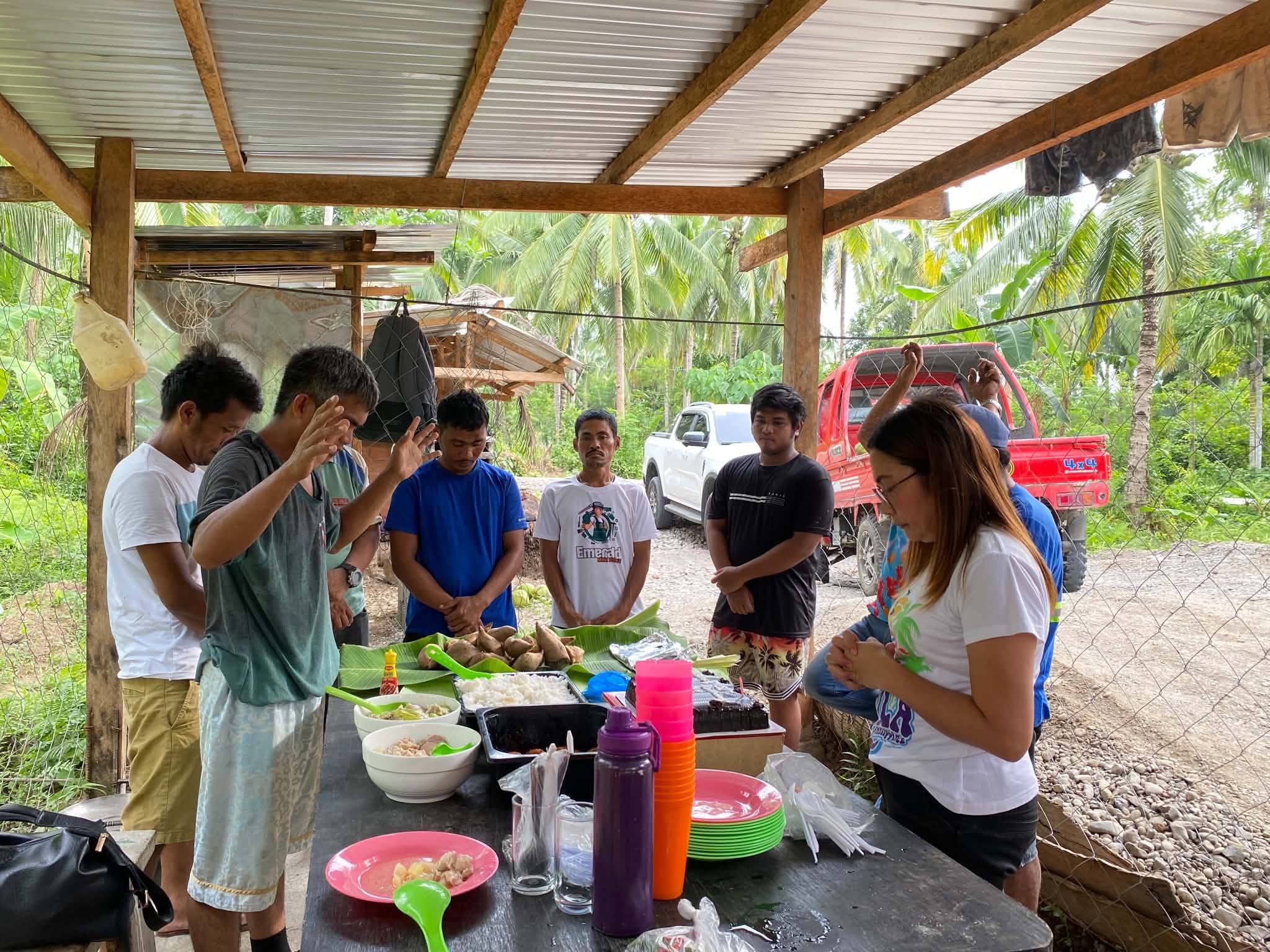 G2 team members gathered around a shared meal